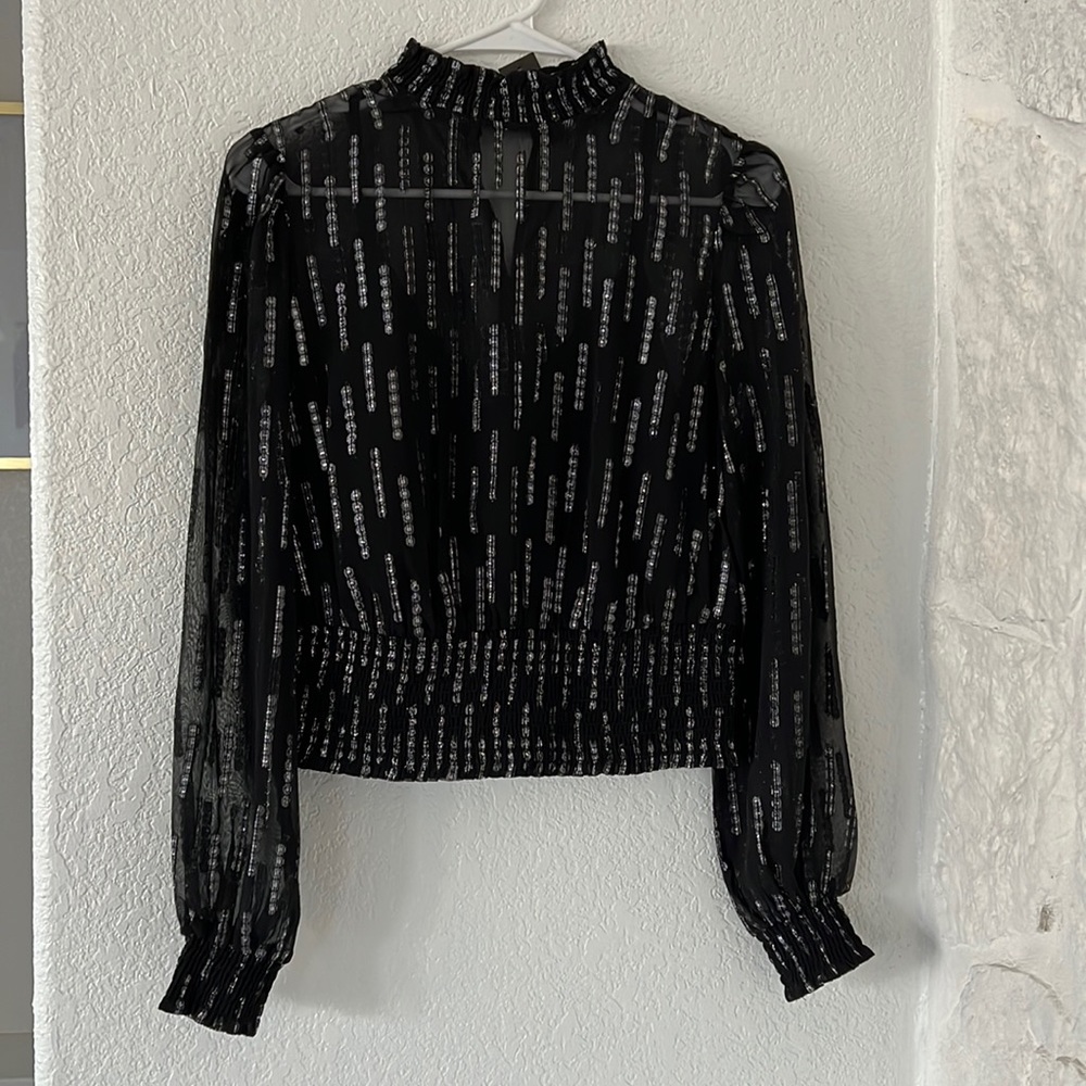 Express black and silver metallic smocked waist top.